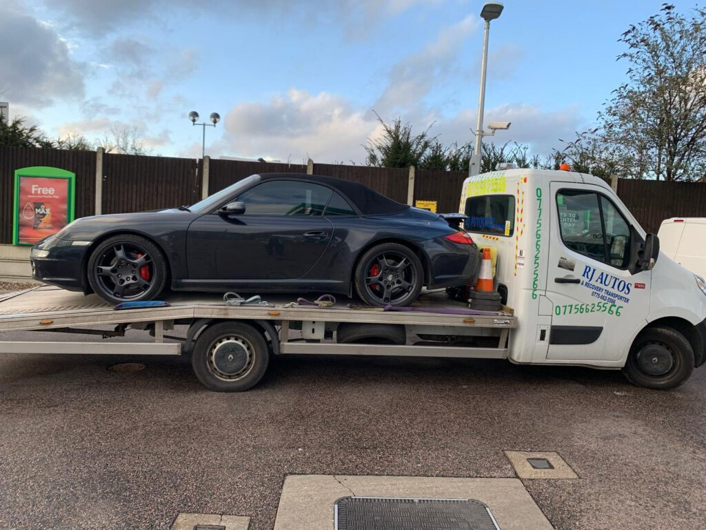 car towing by truck in london