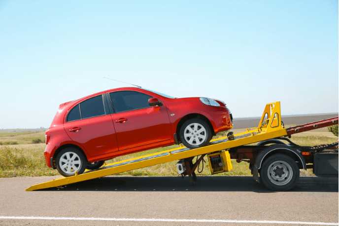 team is towing the vehicle in Acton London