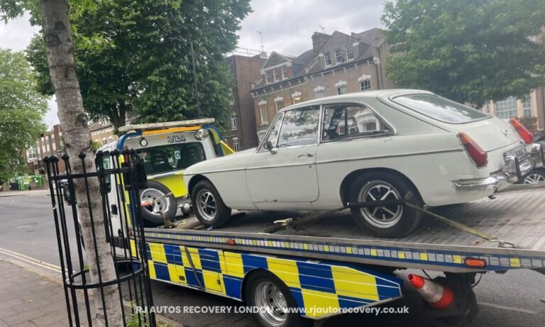 old car towing on london streets