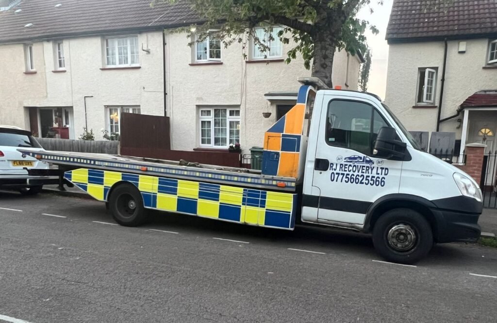 Breakdown recovery truck from RJ Auto Recovery LTD on a residential street in London